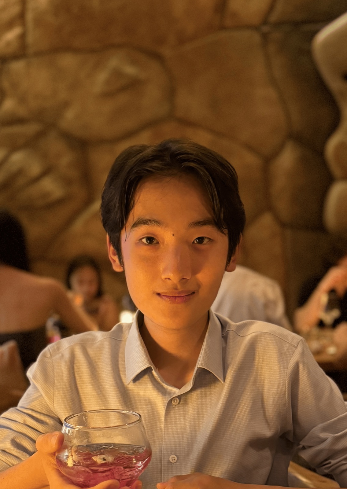 Alexander Tian seated at a restaurant